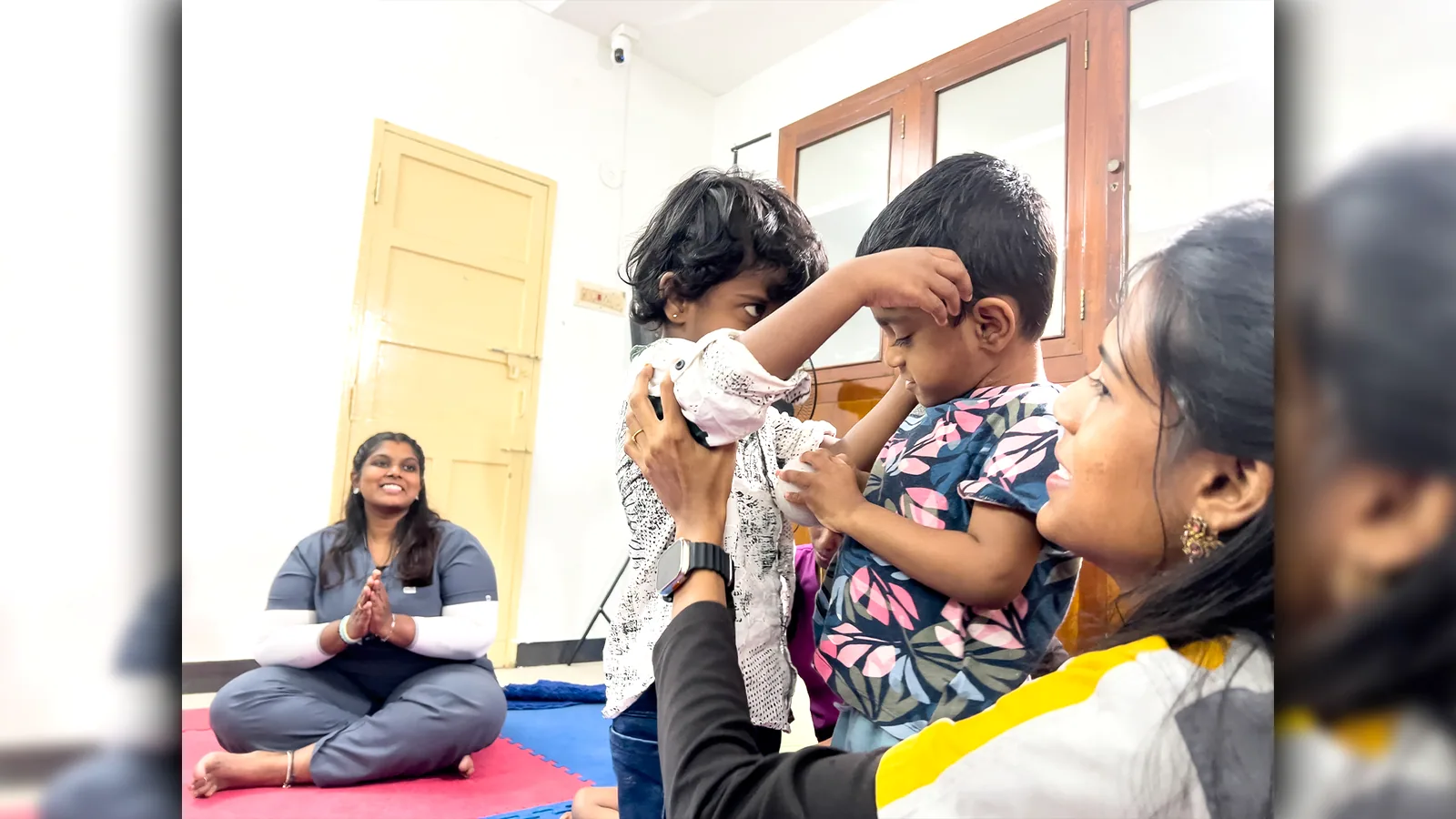 DARC therapist supporting children in a therapy activity